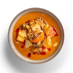Slow Cooked Lamb in Mussaman Curry - slow cooked lamb leg with onion, potato, carrot, pineapple, roasted peanut finished with crunchy fried shallot [GF]