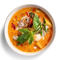 Red Duck Curry - traditional curry cooked with pumpkin, green bean, zucchini, capsicum, Thai sweet basil, roasted duck, and lychee